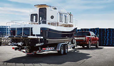 2022 Nissan TITAN Truck towing boat | Landers McLarty Nissan Huntsville in Huntsville AL